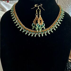 Gold and Green Gemstone Necklace with Intricate Filigree